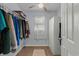 Walk-in closet provides efficient storage and features a window for natural light at 613 Cypress Dr., Surfside Beach, SC 29575