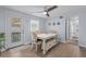 This cozy dining room features hardwood floors, a ceiling fan, and a door to the outside at 613 Cypress Dr., Surfside Beach, SC 29575