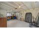 Spacious garage includes storage cabinets and space for tools and equipment, perfect for hobbyists and home maintenance at 613 Cypress Dr., Surfside Beach, SC 29575