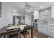 Bright eat-in kitchen features stylish herringbone tile backsplash and stainless steel appliances at 613 Cypress Dr., Surfside Beach, SC 29575