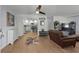 Open-concept living room with modern decor, showcasing wood floors and a seamless flow to the kitchen at 613 Cypress Dr., Surfside Beach, SC 29575