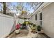 Private patio area includes an umbrella-covered table and chairs, perfect for relaxing and outdoor dining at 613 Cypress Dr., Surfside Beach, SC 29575