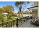 Cozy front porch with decorative railing, offering a view of the street and landscaped front yard at 613 Cypress Dr., Surfside Beach, SC 29575