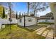 Well-maintained shed features a stylish exterior and a small patio, adding charm and utility to the backyard at 613 Cypress Dr., Surfside Beach, SC 29575