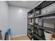 Storage area with shelving, light blue walls and laminate wood flooring at 613 Cypress Dr., Surfside Beach, SC 29575