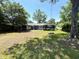 Expansive backyard with patio and mature trees, great for outdoor activities at 710 62Nd Ave. N, Myrtle Beach, SC 29572