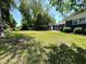 Spacious backyard with mature trees, providing ample shade at 710 62Nd Ave. N, Myrtle Beach, SC 29572