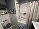 Bathroom features subway tile, a shower/tub combo, and a patterned floor at 710 62Nd Ave. N, Myrtle Beach, SC 29572