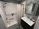 Bathroom with a shower/tub combo, modern sink vanity, and black and white tile floors at 710 62Nd Ave. N, Myrtle Beach, SC 29572