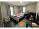 Bright bedroom with cute decor, a patterned rug, and natural light at 710 62Nd Ave. N, Myrtle Beach, SC 29572
