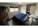 Bedroom with a window, closet, and a classic wooden dresser at 710 62Nd Ave. N, Myrtle Beach, SC 29572