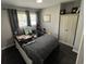 Bedroom with a large bed, window, and storage cabinets at 710 62Nd Ave. N, Myrtle Beach, SC 29572