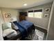 Comfortable bedroom with a cozy bed, window, and framed art on the walls at 710 62Nd Ave. N, Myrtle Beach, SC 29572