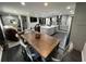 Open dining area with table and chairs connects kitchen and living room at 710 62Nd Ave. N, Myrtle Beach, SC 29572