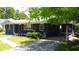 Charming home with manicured lawn, inviting porch, and red shutters at 710 62Nd Ave. N, Myrtle Beach, SC 29572