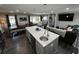 Kitchen island with sink, dining area and views into living room space at 710 62Nd Ave. N, Myrtle Beach, SC 29572