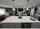 Kitchen island with dining area and views into living room space at 710 62Nd Ave. N, Myrtle Beach, SC 29572