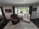 Cozy living area with a comfortable chair by a bright window at 710 62Nd Ave. N, Myrtle Beach, SC 29572