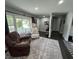 Comfortable living room with cozy seating, area rug, and a sun-filled window at 710 62Nd Ave. N, Myrtle Beach, SC 29572
