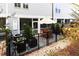 Backyard patio featuring a dining area, surrounded by lush landscaping and a charming fence at 72 Landing Rd. # 0, Pawleys Island, SC 29585