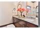 Elegant bathroom featuring granite countertops, dual sinks and a decorative mirror at 72 Landing Rd. # 0, Pawleys Island, SC 29585