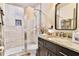 Updated bathroom featuring tiled walk-in shower, granite vanity, and neutral finishes at 72 Landing Rd. # 0, Pawleys Island, SC 29585
