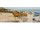 Beautiful beach with a wooden walkway leading to the sand and ocean, filled with people enjoying the day at 72 Landing Rd. # 0, Pawleys Island, SC 29585