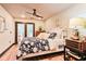 Comfortable bedroom featuring hardwood floors, shiplap walls and patio doors for relaxing and easy access to outdoor living at 72 Landing Rd. # 0, Pawleys Island, SC 29585