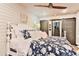 Cozy bedroom features shiplap walls, a ceiling fan, and neutral décor offering a restful retreat at 72 Landing Rd. # 0, Pawleys Island, SC 29585
