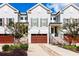 Charming townhome exterior featuring a brown garage door and professionally landscaped front yard at 72 Landing Rd. # 0, Pawleys Island, SC 29585