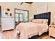 Serene main bedroom with a sitting area, plush bedding, and stylish decor at 72 Landing Rd. # 0, Pawleys Island, SC 29585