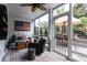 Spacious screened porch with a ceiling fan, outdoor furniture, and views of the lovely landscaped yard at 72 Landing Rd. # 0, Pawleys Island, SC 29585