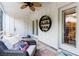 Inviting screened porch featuring comfortable seating and views of the landscaped backyard at 72 Landing Rd. # 0, Pawleys Island, SC 29585