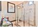 Modern bathroom with a glass-enclosed shower, tiled walls and decorative accents at 72 Landing Rd. # 0, Pawleys Island, SC 29585