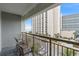 Condo balcony with seating overlooking city street at 7200 N Ocean Blvd. # 438, Myrtle Beach, SC 29577