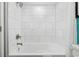 Bright white tiled shower and tub combo with modern shower head and fixtures at 7200 N Ocean Blvd. # 438, Myrtle Beach, SC 29577