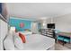 Relaxing bedroom with two beds, a table with chairs, and a wall-mounted TV at 7200 N Ocean Blvd. # 438, Myrtle Beach, SC 29577