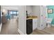 Condo kitchenette with microwave, coffee maker, and view into bedroom and bathroom at 7200 N Ocean Blvd. # 438, Myrtle Beach, SC 29577