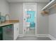 Condo kitchenette and view into the modernly updated bathroom at 7200 N Ocean Blvd. # 438, Myrtle Beach, SC 29577