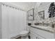 Charming bathroom featuring patterned wallpaper, granite vanity, and white cabinets at 90 Carolina Crossing Blvd., Little River, SC 29566