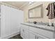 Bathroom featuring double sinks with granite countertops and white cabinets at 90 Carolina Crossing Blvd., Little River, SC 29566