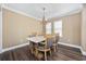 Dining room with chandelier, natural lighting, and table with seating for four at 90 Carolina Crossing Blvd., Little River, SC 29566