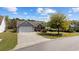 Charming single-Gathering home with a two-car garage, well-manicured lawn, and mature landscaping at 90 Carolina Crossing Blvd., Little River, SC 29566