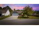 Charming single-story home featuring a manicured lawn, mature tree, and a two-car garage at 90 Carolina Crossing Blvd., Little River, SC 29566