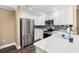 Modern kitchen features stainless steel appliances, white cabinets, and elegant countertops at 90 Carolina Crossing Blvd., Little River, SC 29566