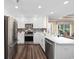 Bright, modern kitchen featuring stainless appliances, white cabinets, and backyard views at 90 Carolina Crossing Blvd., Little River, SC 29566