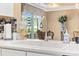 Well-appointed kitchen area featuring modern fixtures and sliding door access to pool at 90 Carolina Crossing Blvd., Little River, SC 29566