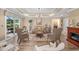 Elegant living room featuring an open layout, chandelier lighting, and stylish seating at 90 Carolina Crossing Blvd., Little River, SC 29566