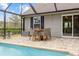 Outdoor dining area by the pool featuring a patio, with a view of the house and yard at 90 Carolina Crossing Blvd., Little River, SC 29566