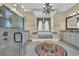 Elegant bathroom featuring a soaking tub, walk-in shower, and stylish chandelier lighting at 9243 Marina Pkwy., Myrtle Beach, SC 29572